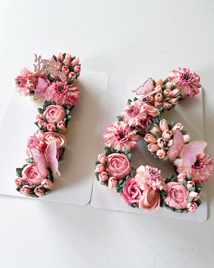 two letters decorated with pink flowers and butterflies