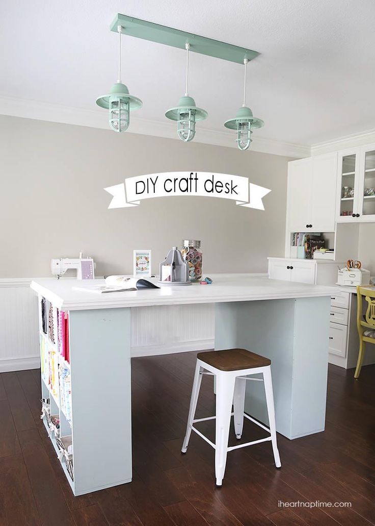 a white desk with two stools in front of it and a sign that says diy craft desk