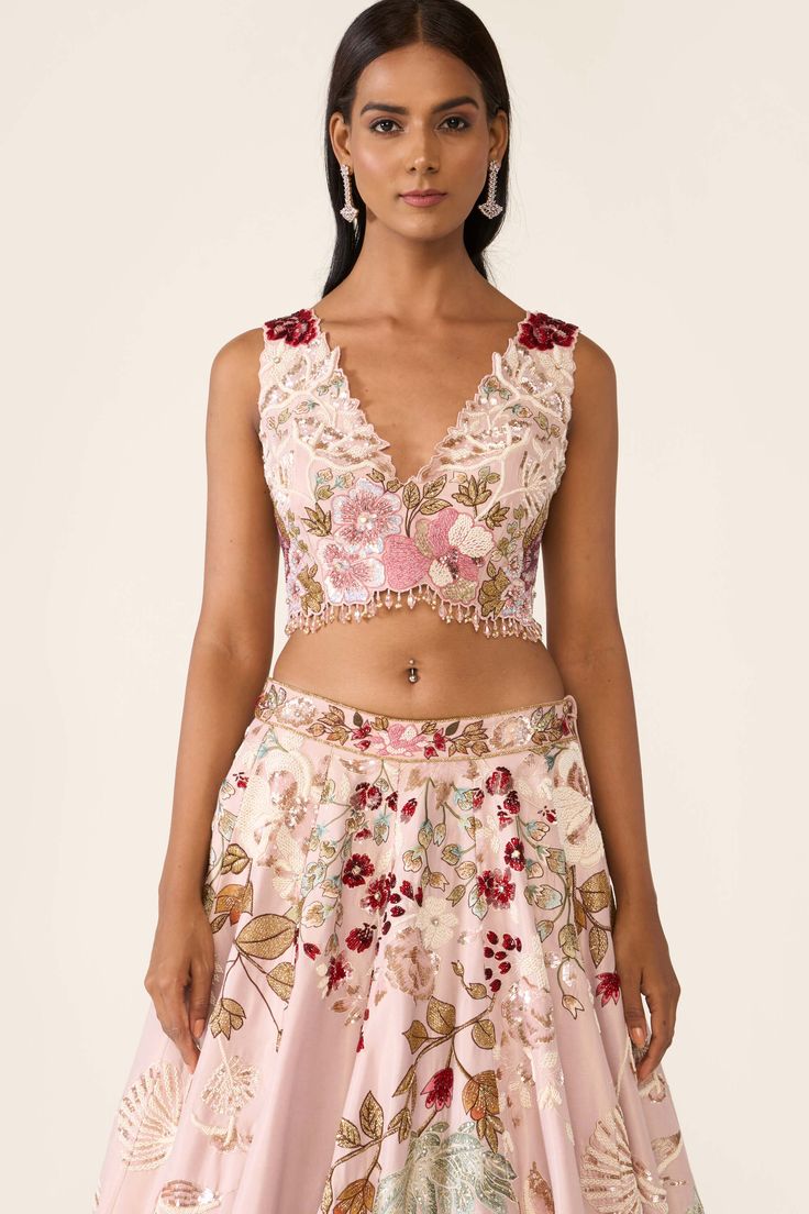 The pink lehenga is created with multicolor threadwork embroidery is embellished with sequin, cutdana, beads and stones. It is paired with classic blouse and dupatta with thread and bead work. Threadwork Embroidery, Classic Blouse, Indian Jewelry Earrings, Gold Mangalsutra Designs, Gold Mangalsutra, Pink Lehenga, Classic Blouses, Embroidered Lehenga, Mangalsutra Designs