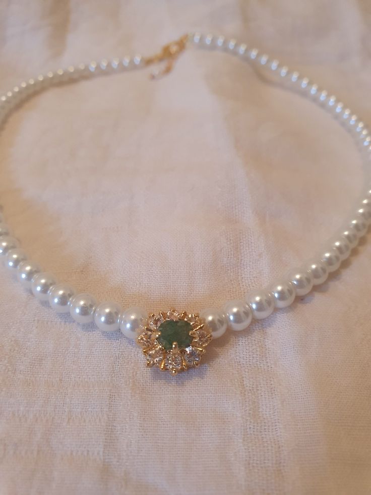 "NEW!!  Stunning and unique vintage style 1 strand of pearls choker necklace for the bride features soft white pearls and Emerald stone in the middle surrounded with clear zirconium.   This beautiful necklace can fit any style of white wedding dress. The shape is vintage Victorian and fits so beautiful on your neck. A perfect necklace for the bride or for another special occasion. This necklace versatile for many wedding styles; from classic summer to an occupied elegant evening. I can only imag