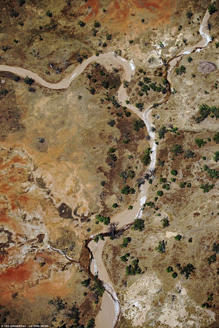 an aerial view of a river in the desert