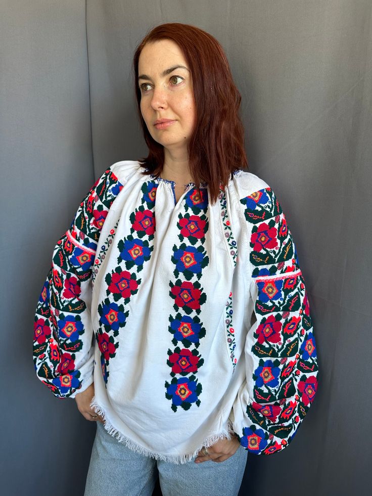 Amazing antique Romanian blouse Interesting design in so expressive colours Extremly much area of embroidery on extremely big sleeves Not usual location of a pattern Also there's embroidery on the  back  Effective one! Great vintage condition  Everything is handmade ! ready to be worn! Will fit for S M L  size   I am 167 cm(65.7) growth and s-m size!  Mention, that every dress has a single copy you will never meet the same Traditional Long Sleeve Shirt With Intricate Embroidery, Folk Style Long Sleeve Top With Embroidered Cuffs, Long Sleeve Embroidered Folk Shirt, Embroidered Long Sleeve Folk Shirt, Traditional Long Sleeve Shirt With Floral Embroidery, Traditional Long Sleeve Top With Embroidered Cuffs, Traditional Long Sleeve Embroidered Top With Embroidered Cuffs, Folk Style Embroidered Long Sleeve Peasant Top, Folk Style Long Sleeve Tops With Motif