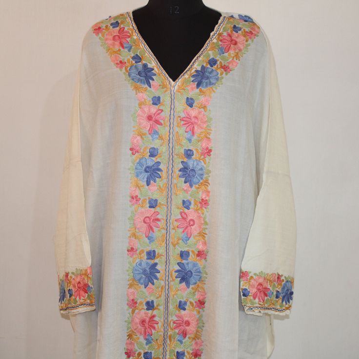 Kashmiri Aari Embroidered pure merino wool Kaftan.A Stunningly Marvellous Kaftan.This Kaftan Is Made Of pure merino wool Its Embroidered With multi Colour.The Embroidery Done On This Is A Traditional Kashmiri Embroidery Known As 'Aari Work''. Product Details - Condition: Brand New - Handmade - Style: Kaftan - Fabric: pure merino wool - Embroidery: Kashmiri Aari Embroidery - Length: 57'' Inch - Chest: 60'' Inch (Loose Fit) (One Size Fits M/L/Xl/Xl/2x/3x/4x) - Care Instructions: Handwash Only (Use Cold Water) - Ironing: Use Steam Ironing - Free Shipping : Yes Traditional V-neck Kurta With Chikankari Embroidery, Bohemian Unstitched Kaftan For Spring, Embroidered Kurti Designs Latest, Cream Bohemian Kurta With Chikankari Embroidery, Traditional V-neck Dress With Embroidered Border, Bohemian V-neck Kurta With Intricate Embroidery, Festive Multicolor Embroidered Dress With Long Sleeves, Festive Multicolor Long Sleeve Embroidered Dress, Festive Multicolor Embroidered Long Sleeve Dress