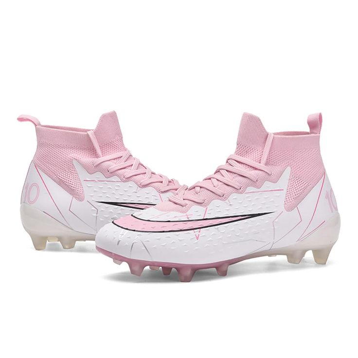 a pair of pink and white soccer shoes