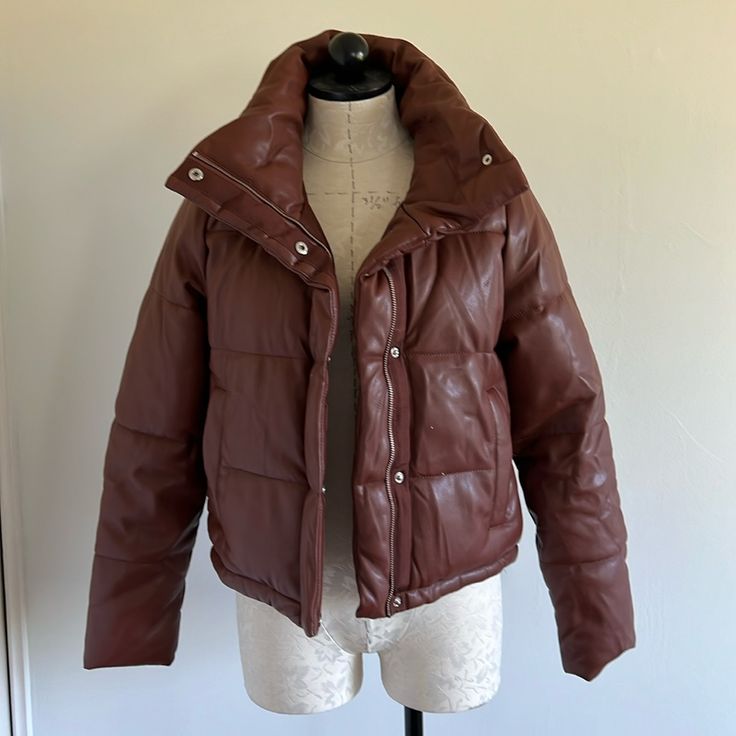 Good Condition. Brown Winter Puffer Outerwear, Brown Puffer Outerwear For Winter, Brown Puffer Outerwear For Cold Weather, Brown Quilted Winter Outerwear, Brown Winter Outerwear With Padded Collar, Winter Brown Outerwear With Padded Collar, Brown Padded Collar Outerwear For Winter, Classic Fall Puffer Jacket, Classic Leather Jacket With Padded Collar For Fall