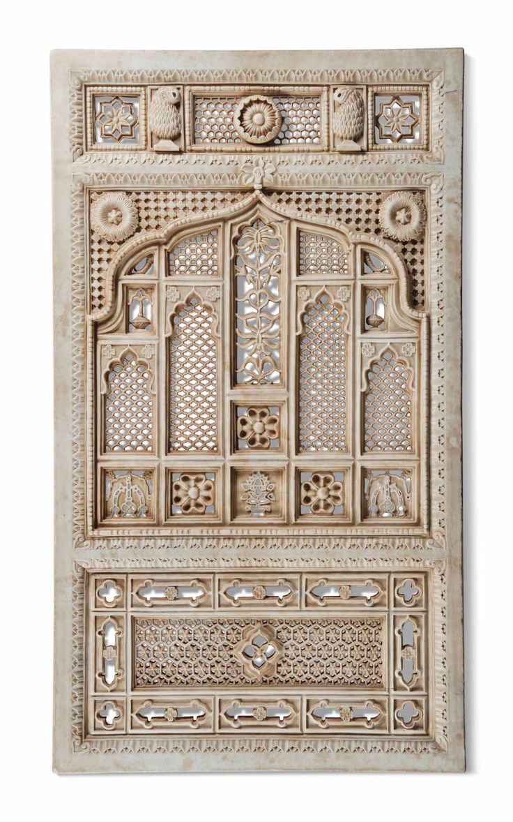 an intricately carved wall panel