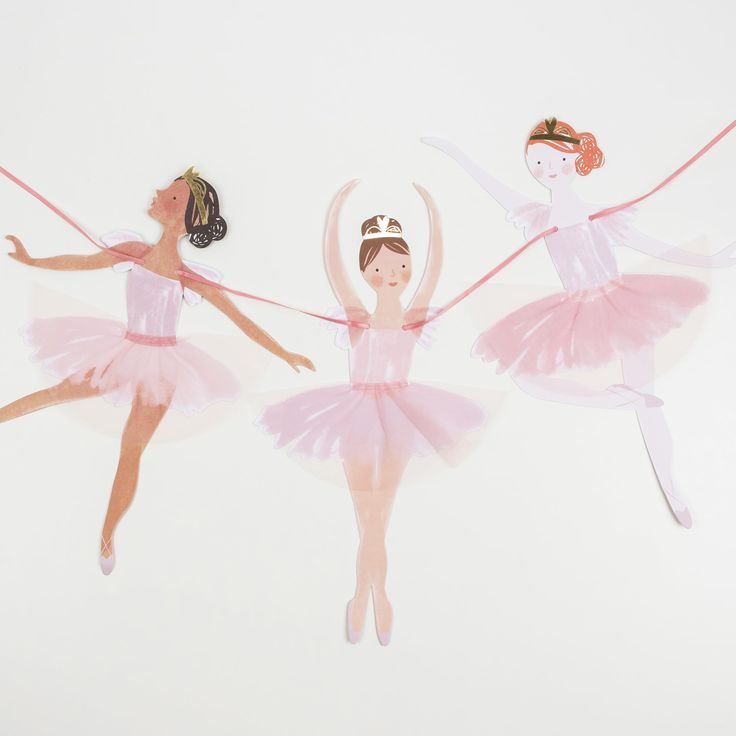 three ballerinas in pink tutus are pulling the string with their hands together