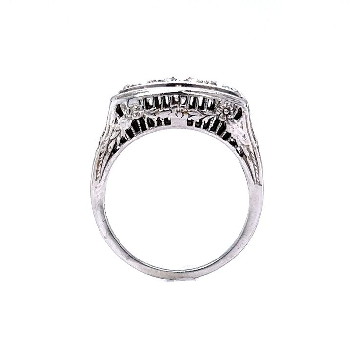 a white gold ring with three diamonds on it