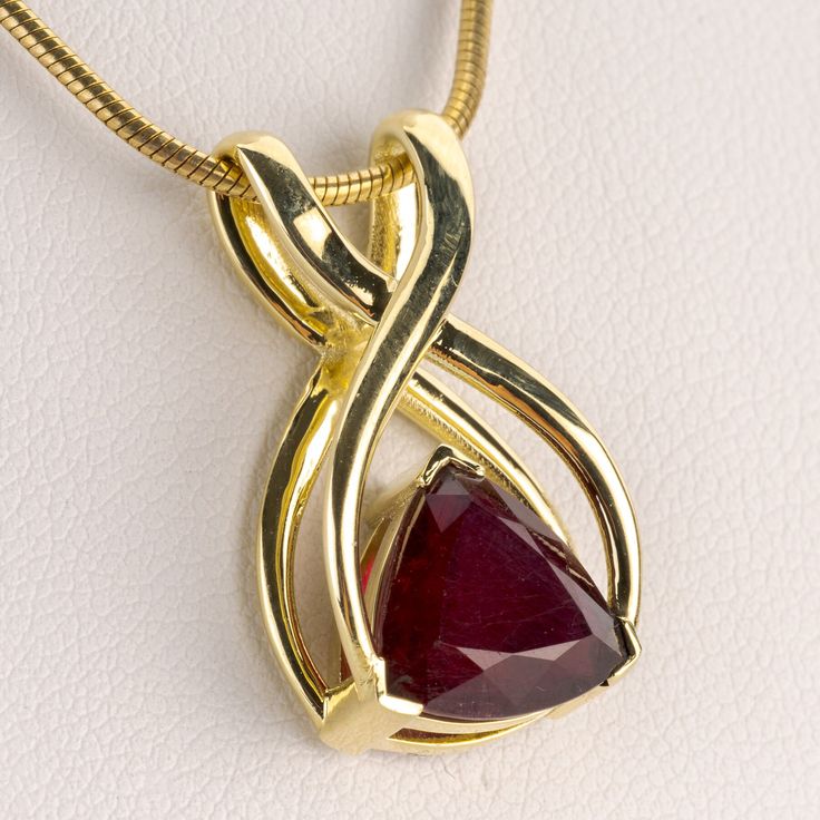 A pendant from our gemstone-oriented "Diana" collection, combining a ruby of 3,83 carats with a minimalistic design concept in 14 karat yellow gold Metal 14k / 0.585k Gemstones 1 ruby 3.83ct Measurements 24 x 14 mm Weight 4.6g Condition New General Information All items come with certificate of authenticity, gemstones have been tested at our lab if not otherwise indicated. Pendants are shown with chain for decorational reasons, please note that they do not come with a chain. Payment We accept pa Yellow Gold Ruby Jewelry, Fine Jewelry With Lab-created Ruby In Yellow Gold, Fine Jewelry Yellow Gold Lab-created Ruby, Yellow Gold Jewelry With Lab-created Ruby, Polished Yellow Gold Ruby Jewelry, Yellow Gold Ruby Jewelry Stamped 14k, Fine Jewelry Ruby In Yellow Gold, Fine Jewelry In Yellow Gold With Ruby, Ruby Pendant In Yellow Gold