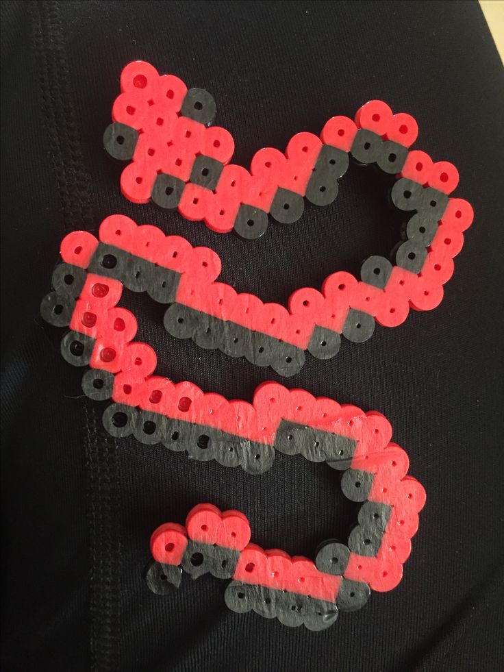 the letters are made out of plastic beads