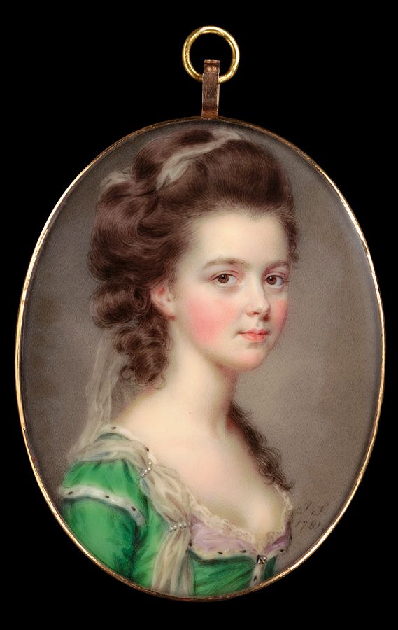 a portrait of a young woman in a green dress