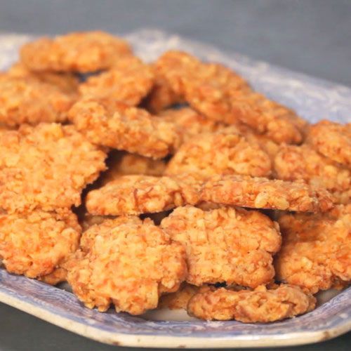 some fried food is on a blue and white plate