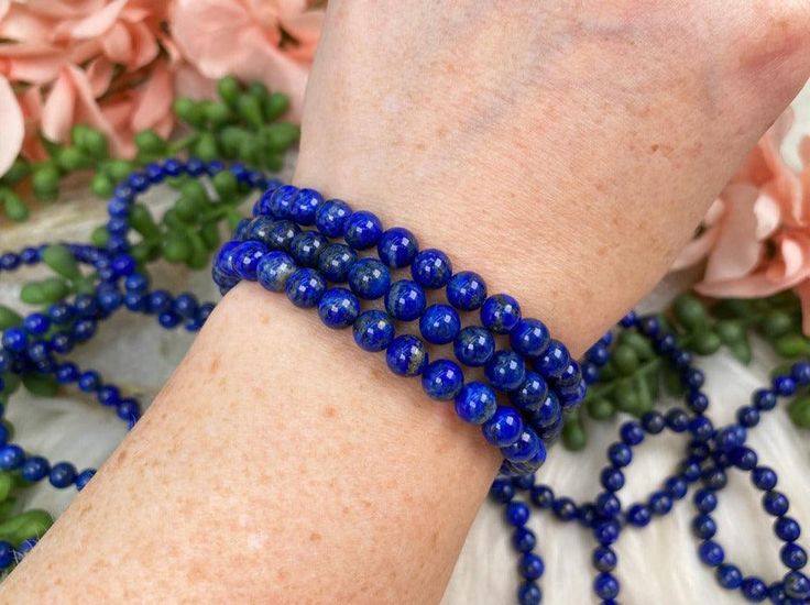 Wearing a Blue Lapis Lazuli bracelet not only makes a stylish accessory but also brings a wealth of symbolic meaning and metaphysical properties into your daily life. You will receive ONE Lapis Lazuli bracelet that is intuitively chosen for you.Approx Bead Size: 6-7mmApprox Size: 5.75" - 6.5" around. Colors and bead size may vary. Lapis Lazuli Bracelet Benefits Lapis Lazuli is renowned for its deep blue hue and has long been associated with enhancing communication, making it particularly benefic Lapis Lazuli Bracelet For Meditation, Blue Spiritual Beaded Bangle Bracelets, Blue Spiritual Wrap Bracelet With Gemstone Beads, Spiritual Blue Gemstone Beads Wrap Bracelet, Spiritual Blue Beaded Bangle Bracelets, Spiritual Blue Beaded Bangle Bracelet, Spiritual Blue Wrap Bracelet With Gemstone Beads, Symbolic Blue Bracelet Jewelry, Blue 108 Beads Bracelet Jewelry