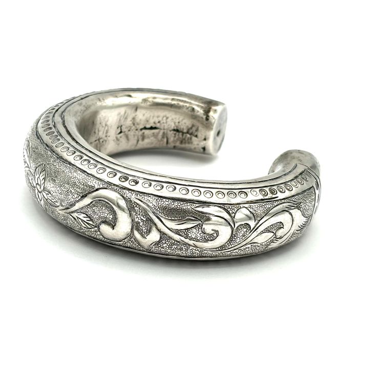 Vintage Thai hand engraved 800 silver hollow cuff bracelet. 800 XRF tested. 7/8" wise with a 2.25" interior. 75 grams. Symbolic Engraved Sterling Silver Cuff Bracelet, Antique Engraved Cuff Bangle Bracelet, Ornate Engraved Cuff Bracelet For Ceremonial Occasions, Antique Engraved Cuff Bracelet, Formal Antique Silver Engraved Bangle, Antique Silver Engraved Cuff Bracelet, Silver Vintage Engraved Cuff Bracelet, Antique Engraved Silver Cuff Bracelet, Vintage Silver Cuff Bracelet With Engraving