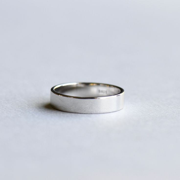 DESCRIPTION: >Plain and simple wear-it-every-day band. >925 Sterling Silver fully hallmarked. >Sterling silver is an almost pure metal made from 92.5% Silver. >Approx 4.4mm x1.25mm Yellow gold plated: https://www.etsy.com/listing/529362003/14k-yellow-gold-plated-band-plain-band?ref=shop_home_active_9 Rose Gold Plated: https://www.etsy.com/listing/527943530/14k-rose-gold-ring-plain-ring-minimalist?ref=shop_home_active_11&frs=1 FREE SHIPPING USA- All of our jewelry will arrive in c Minimalist Thick Band For Everyday Wear, Minimalist Couple Rings For Anniversary, Modern Thick Band Midi Rings For Anniversary, Modern Silver Couple Rings For Everyday, Minimalist Polished Couple Promise Rings, Minimalist Open Band Gift Bands, Minimalist Open Band As Gift, Minimalist Silver Ring With Simple Design, Minimalist Round Bands With Simple Design