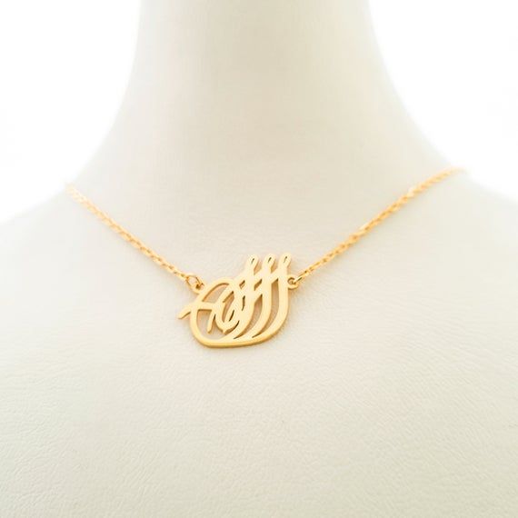 This necklace is a piece of our new collection of Allah necklace made from sterling silver and 14k gold. The collection includes different designs that suit all tastes Kufi/calligraphy, heart/rectangle/triangle shapes, tiny/big sizes. Here is the link for the full collection: https://etsy.me/2Swd0lPAll the designs can be made as necklace, bracelet, and earrings. If you also want a complete set that includes a necklace, a bracelet and earrings please get in touch with us. We accept custom orders! Gold Sterling Silver Charm Necklace With Custom Name, Custom Name Gold Plated Pendant Jewelry, Symbolic Gold Jewelry With Name Detail, Gold Initials Jewelry As A Gift For Mom, Symbolic Gold Name Necklaces, Symbolic Gold Name Necklace, Gold Minimalist Initial Pendant Necklace, Handmade Yellow Gold Necklace For Personalized Gift, Handmade 14k Gold Jewelry For Mom