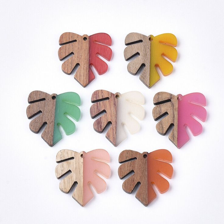 six wooden leaves with different colors on them