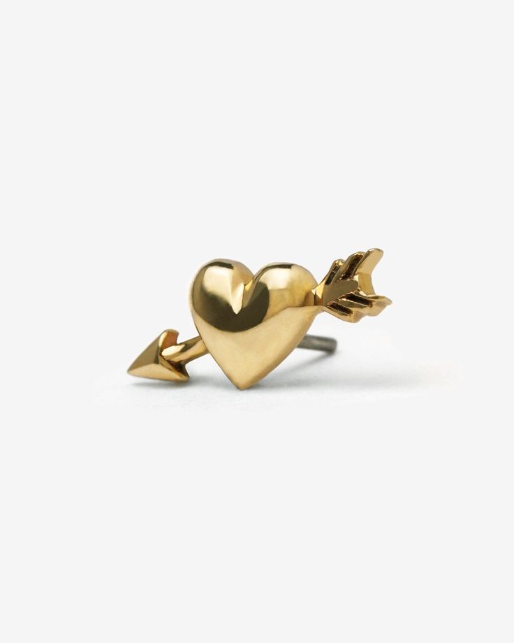 All our demi-fine 14K gold jewelry include a 1-year warranty. Click here to find out more. A nano hold of Cupid’s calling, crafted to pierce tender hearts and leave the indelible mark of love on all his targets. Demi-fine alternative jewelry to adorn your soul. A solid 14K Gold threadless end of a heart diagonally pierced by an arrow. Suitable for piercings including ear lobe, ear cartilage (helix, forward helix, flat, tragus, conch), nostril, lip (Medusa, labret). Sold individually, post not in 14k Gold Jewelry For Anniversary, Valentine's Day Gift, Gold Jewelry For Valentine's Day Promise, Gold Promise Jewelry For Valentine's Day, Valentine's Day Promise Jewelry With Polished Finish, Gauges Earrings, Tragus Conch, Forward Helix, Alternative Jewelry, Gold Pin