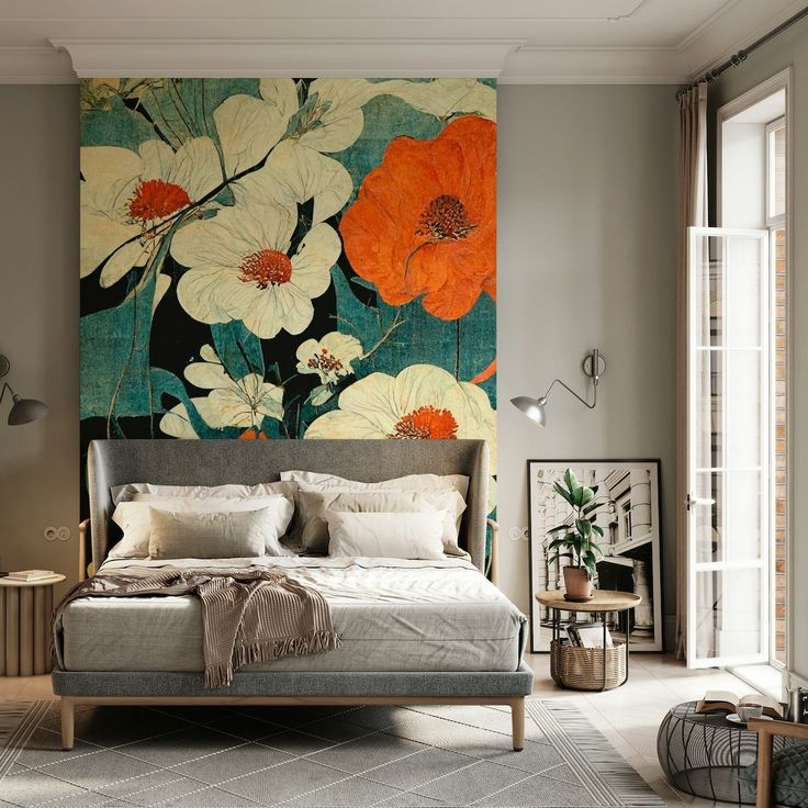 a bed sitting in a bedroom next to a large painting on the side of a wall