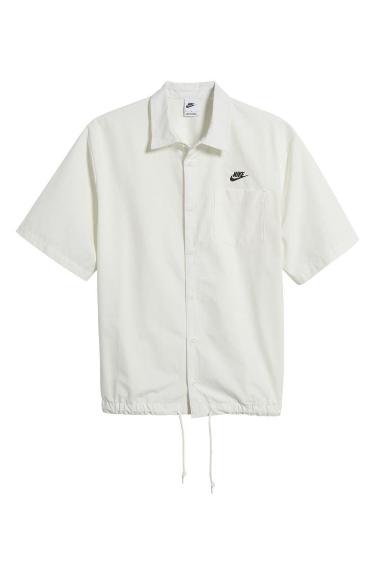 An adjustable drawstring hem changes up the look of this roomy cotton button-up shirt. 28" length; 48" chest (size Medium) Front button closure Point collar Short sleeves Chest patch pocket Drawstring hem 100% cotton Machine wash, tumble dry Imported Casual Nike Tops With Pockets, Casual Cotton Camp Shirt For Daywear, Nike Cotton Shirt With Relaxed Fit, Nike Casual Collared Shirt, Casual Nike Collared Shirt, Relaxed Fit Cotton Nike Shirt, Nike Relaxed Fit Shirt For Spring, Cotton Camp Shirt Button-up, Cotton Button-up Camp Shirt For Daywear