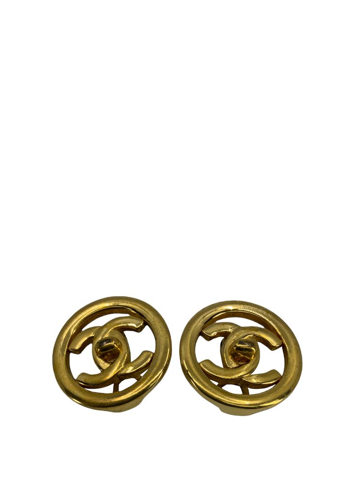 Prepare to turn heads with these  CHANEL Vintage CC Turnlock Logo Round Clip On Earrings. These gold-tone metal plated earrings feature signature logo engravings and secure clip-on closures. Perfect for day or evening wear with the timeless elegance of Chanel!  Condition: Very Good. Overall clean and beautiful throughout with minor surface scratches. The backs of the clip-on earrings have some signs of wear.    Gold metal 'CC' turn-lock logo Clip-on backings Measurements, 0.9'' x 0.9'' 1997 Lock Logo, Round Logo, Chanel Vintage, Rose Gold Hardware, Timeless Handbag, Luxe Fashion, Vintage Chanel, Signature Logo, Gold Tone Metal