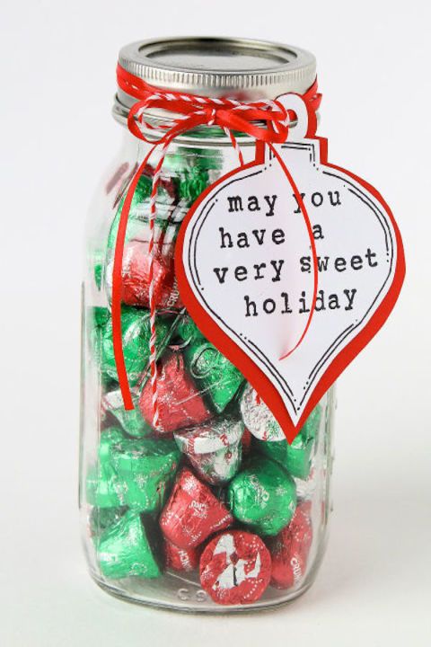 a jar filled with lots of candy sitting on top of a table