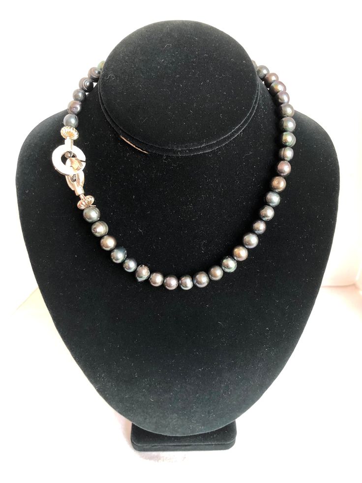 Stunning pearl necklace with unique sterling silver clasp.  These pearls are gray with a slight green tint, and the sterling clasp can be worn in the back, or the side or front to make a statement. Align the slits in the clasp to open and close the necklace. Free shipping. Thank you for shopping in my Etsy store and supporting my small business :) Green Pearl Necklace, Gray Pearl Necklace, Choker Pearl, Grey Pearl Necklace, Hippie Necklace, Green Pearls, Necklace Green, Silver Choker, Necklace Pearl