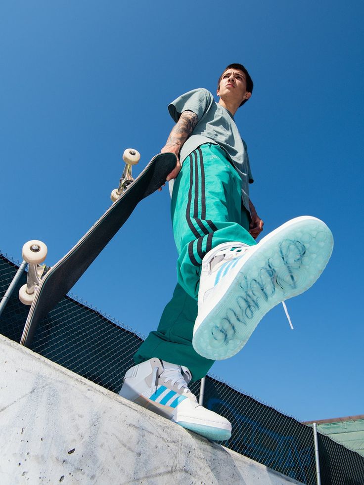 a man riding a skateboard up the side of a ramp