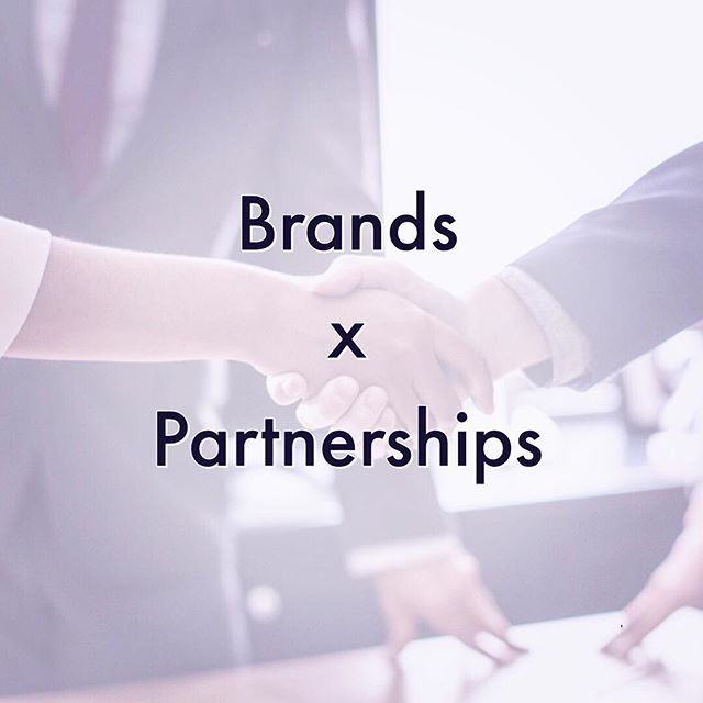 two people shaking hands with the words brands x partners in front of them on a desk