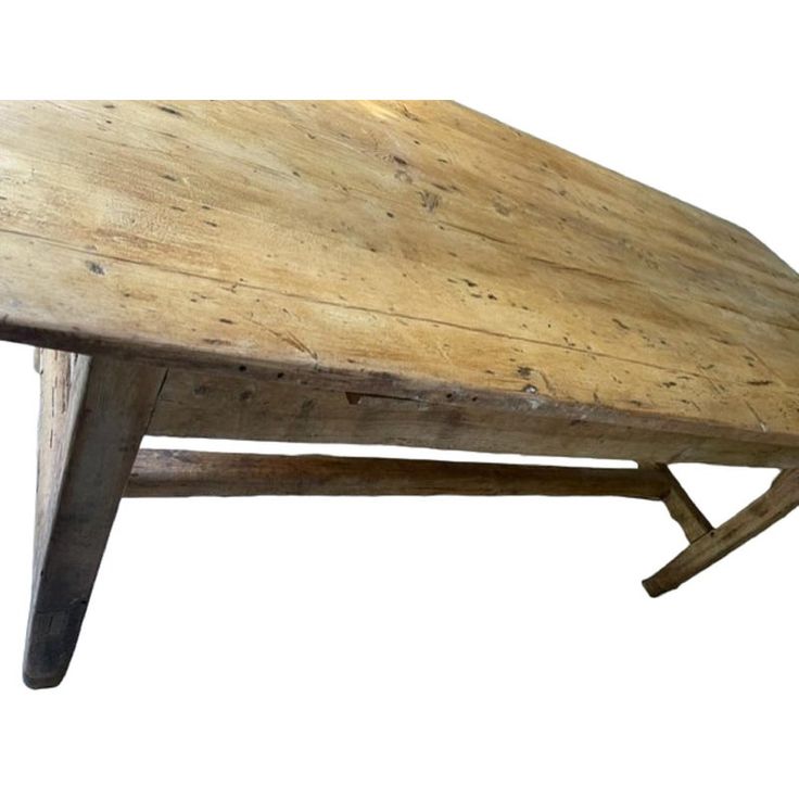 an old wooden table with two legs and a bench top on the bottom one side