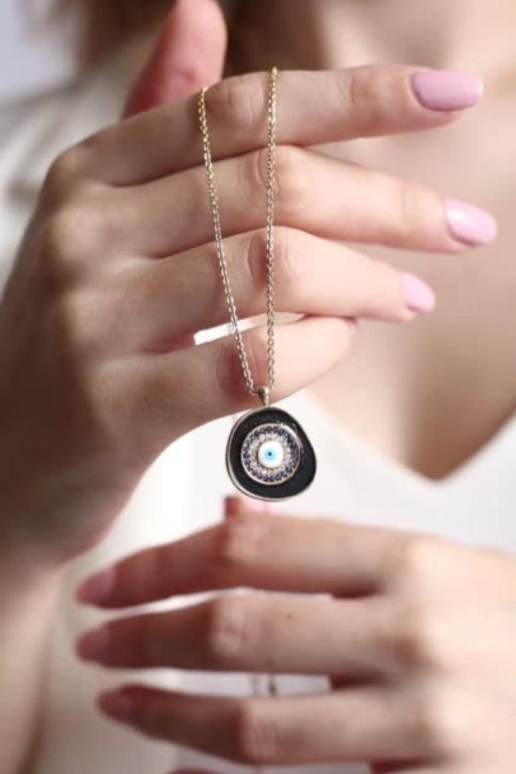 A meaningful and special gift for yourself and others! Black evil eye necklaces protect you and your loved ones. 🥰 DETAILS: - 14K Gold Plated Brass - AAA Best Quality Cubic Zirconia Stones - Dainty and non-Faded Chain ( Chain length: 20 inches; 16" + 4" extender ) - Our Turkish jewelry has a round shape. Diameter is 0.75". A Quarter Coin has 0.95" diameter. SHIPPING: -Free domestic shipping on all orders. All items are shipped with First Class USPS with tracking. Black Personalized Pendant Necklaces, Personalized Black Pendant Necklaces, Personalized Black Jewelry As A Gift, Personalized Black Round Pendant Jewelry, Personalized Black Jewelry For Party, Personalized Spiritual Black Necklaces, Personalized Black Spiritual Necklaces, Personalized Black Spiritual Jewelry, Black Clavicle Chain Charm Necklace