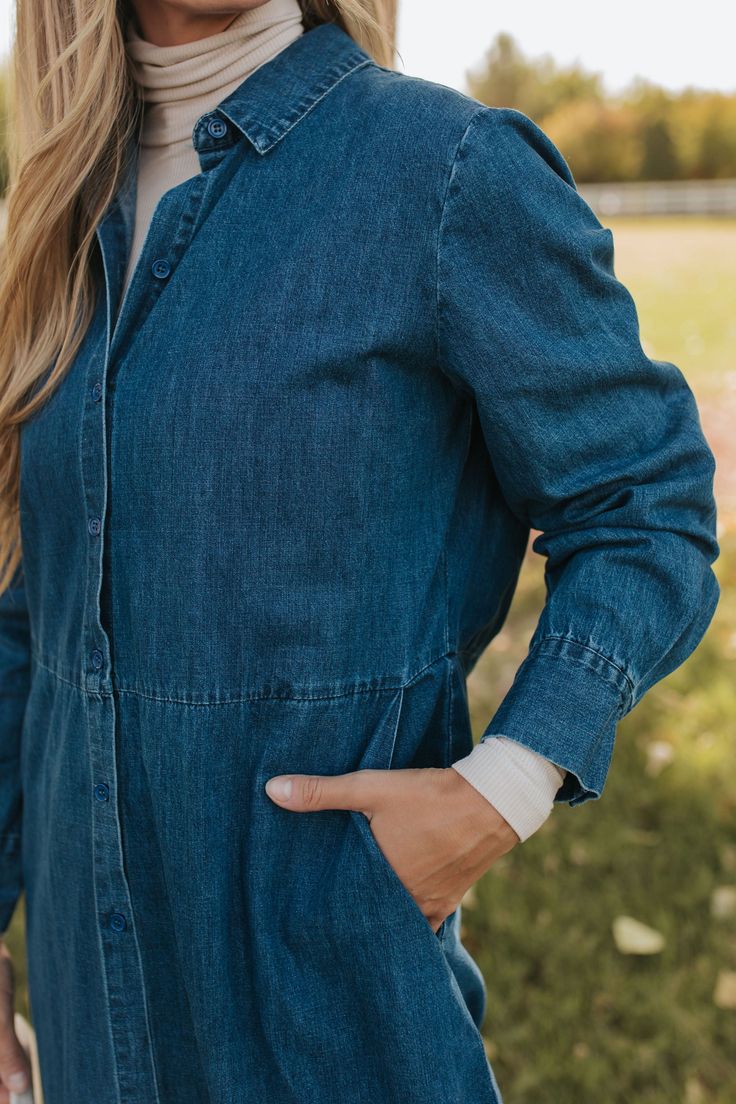 Introducing the ultimate fall fashion statement - THE DEMI BUTTON DOWN MIDI DRESS IN DENIM. This classic and cute dress features a trendy denim fabric, perfect for the season. With long sleeves, you'll be both stylish and cozy. Upgrade your wardrobe with this must-have piece! Paired with THE CONTRAST COWBOY BOOTS IN BLACK Collared neck Long sleeve Button down front Pockets Midi length 100% cotton Dress runs true to size. Small (2-4), Medium (6-8), Large (10-12). Length (shoulder to hem): Small: