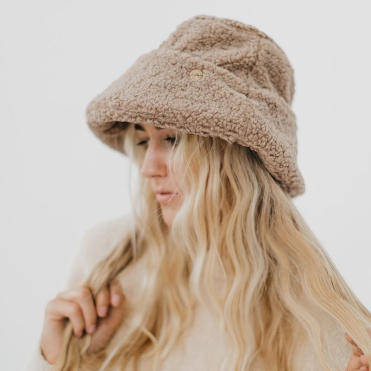 Meet our new Sage Sherpa Bucket Hat! This accessory is perfect for the fall/winter months, keeping you warm and stylish all season long. The Sage hat includes a thicker band around the head to add extra detail to the hat, and it's adjustable! Available in 2 colors including mocha and cream. Material: 100% Polyester Adjustable Cap With Plush Lining, Cozy Adjustable Winter Bonnet, Winter Beanie Hat With Faux Fur Lining, One Size Hats For Cold Weather In Fall, Winter Cap With Plush Lining, Winter Wide Brim Bucket Hat One Size, Winter Wide Brim Bucket Hat, Adjustable Brown Hat With Fleece Lining, Winter Cap With Fleece Lining