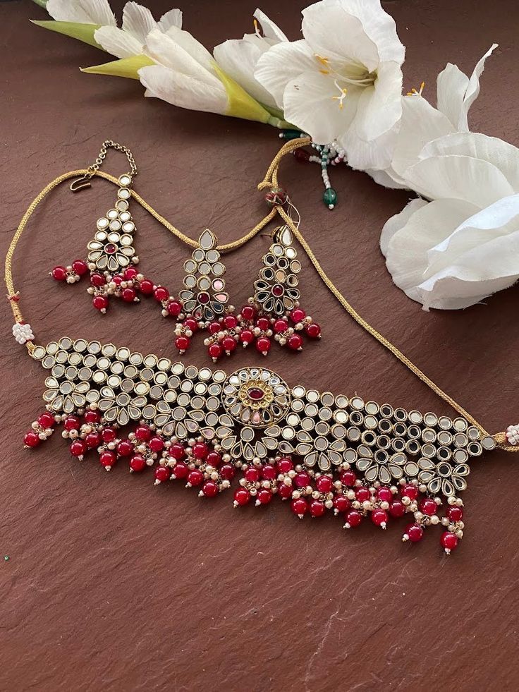 Indian Bridal Traditional One Gram Jewelry Necklace Set. Gorgeous 22 K Antique gold plated. Perfect for Indian weddings. Size- Adjustable Premium Quality and High craftsmanship Gorgeous matte gold plated. Beautiful and elegant polki Necklace. All the raw material used in this product is of high quality and is handcrafted with love. Premium Quality and High craftsmanship 100% Satisfaction Guarantee: Long Lasting Plating, High-Quality Stones. Gifting: This pair of charming necklace and earrings co Heavy Semi-stitched Choli For Festivals, Traditional Heavy Sharara For Festive Occasions, Gold Bollywood Ceremonial Sharara, Festive Heavy Sharara For Festivals, Traditional Anarkali Set With Stone Work For Festivals, Heavy Bollywood Sharara For Festive Occasions, Wedding Bridal Sets With Meenakari, Semi-stitched Traditional Wedding Wear, Traditional Kundan Choli With Stone Work