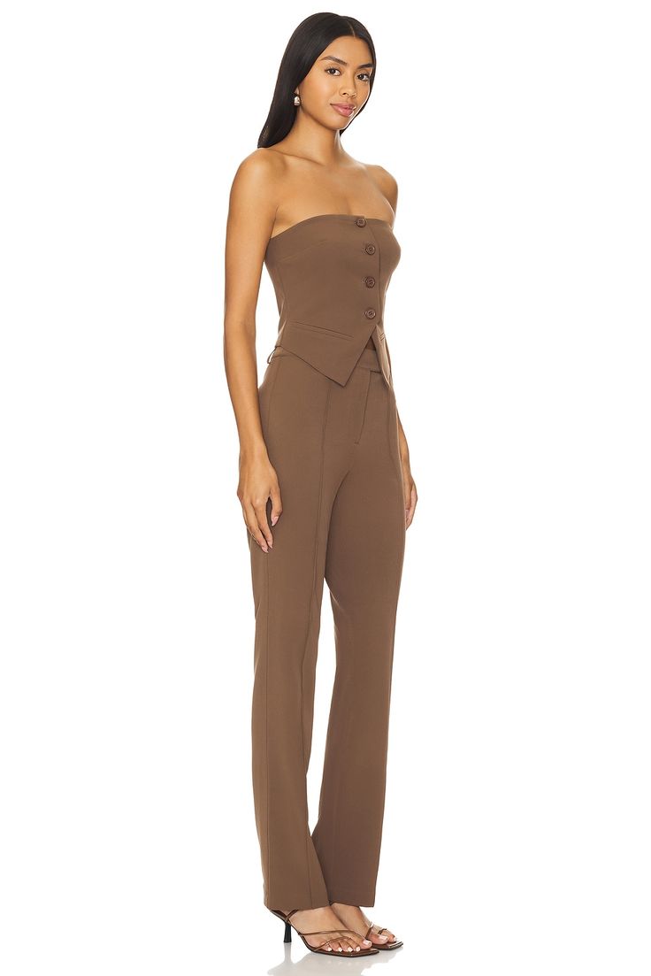 Self: 95% polyester 5% spandex, Lining: 100% polyester.  Made in China.  Hand wash.  Zip fly with button closure.  Front button detail.  Midweight suiting fabric.  Sold as a set.  Neckline to hem measures approx 57" in length, 18" at the knee narrows to 15" at the leg opening.  .  .  .  .  .  .  .  . Fitted Sets With Buttons For Workwear, Fitted Buttoned Sets For Workwear, Fitted Sets With Double Button Closure For Workwear, Fitted Workwear Sets With Buttons, Chic Tailored Sets With Buttons, Fitted Sets With Button Closure For Fall, Fitted Buttoned Sets For Business Casual, Elegant Fitted Pants With Double Button Closure, Fitted Business Casual Sets With Buttons