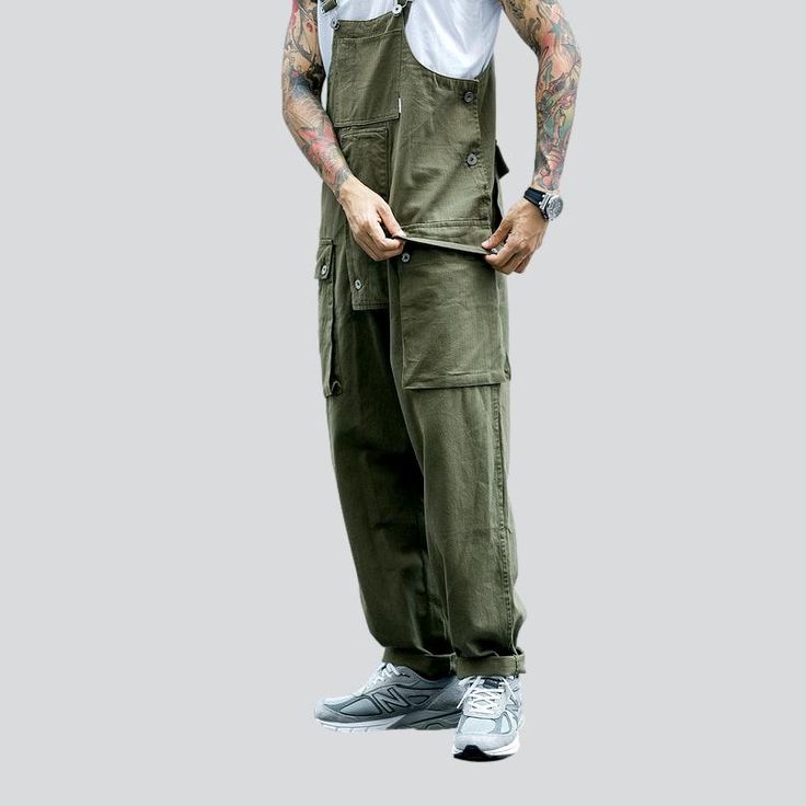 Introducing our 2023 Spring-Summer Collection safari-style baggy bib overalls a urban trend that's sure to turn heads!Why You'll Fall In LoveThis unique silhouette is tailored for the couture-forward who prefer making a statement. With its baggy fit and suspenders closure. you can enjoy a fashion take on the timeless safari-style overalls. Its vibrant colors and sanded finish promise a timeless. laid-back look that'll make you stand out from the crowd.Unmissable Highlights: Baggy Fit: Unparallel Summer Khaki Cargo Pants For Streetwear, Summer Streetwear Khaki Cargo Pants, Utility Overalls With Side Pockets And Bib Front, Baggy Cargo Pants For Summer Outdoor Activities, Utility Cotton Overalls With Patch Pockets, Cotton Overalls With Patch Pockets And Bib Front, Urban Style Relaxed Fit Cargo Pants For Summer, Casual Overalls With Side Pockets, Cargo Style Overall Jumpsuit For Summer