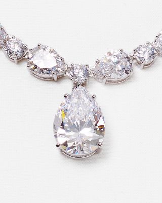 Stay forever scintillating with a classic glowing accent from Nadri like this immaculate strand of cubic zirconia, punctuated by a single pear pendant. Pear-shaped Cubic Zirconia Diamond Necklace For Formal Occasions, Elegant Pear Shaped Drop Necklace With Brilliant Cut, Formal Pear-shaped Cubic Zirconia Diamond Necklace, Elegant Pear-shaped Drop Necklace With Brilliant Cut, Elegant Pear-shaped Brilliant Cut Drop Necklace, Cubic Zirconia Jewelry With Diamond Accents, Pear-shaped, Pear-shaped Cubic Zirconia Jewelry With Diamond Accents, Elegant Teardrop Necklace With Prong Setting, Dazzling Pear-shaped Jewelry For Formal Occasions