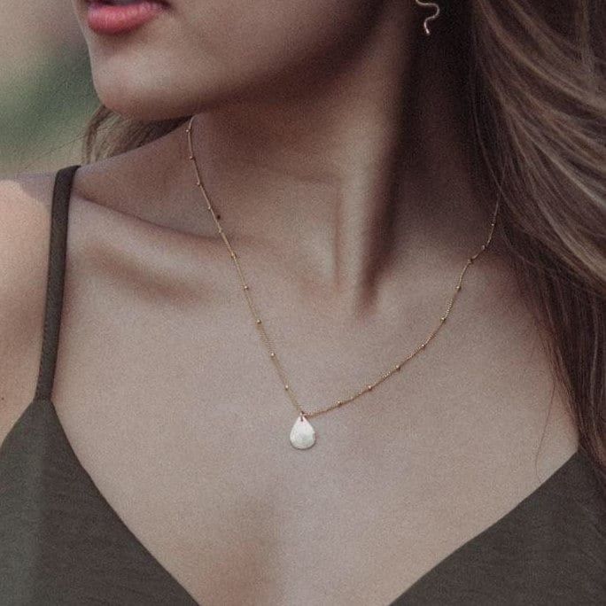 "The Syreni Necklace~  Syreni is Latin for mermaid //  Carry the sea with you wherever you go with our hand forged, water droplet necklace. - 14k gold fill or sterling silver droplet shape  - Hand stamped heart detail  - Simple cable chain, or for a little texture try our beaded chain  - 16\" or 18\" chain. If you would like a 2\" extender added, leave us a note at checkout  - 14k gold fill is nickel-free and suitable for sensitive skin  This piece layers perfectly with our bestselling AURORA ne Delicate Teardrop Charm Necklaces For Everyday, Everyday Delicate Teardrop Charm Necklace, Minimalist Water Drop Jewelry As Gift, Minimalist Water Drop Jewelry For Gifts, Minimalist Water Drop Jewelry Gift, Dainty Teardrop Necklace For Everyday, Dainty Teardrop Drop Necklace For Everyday, Everyday Delicate Teardrop Drop Necklace, Delicate Hammered Teardrop Jewelry