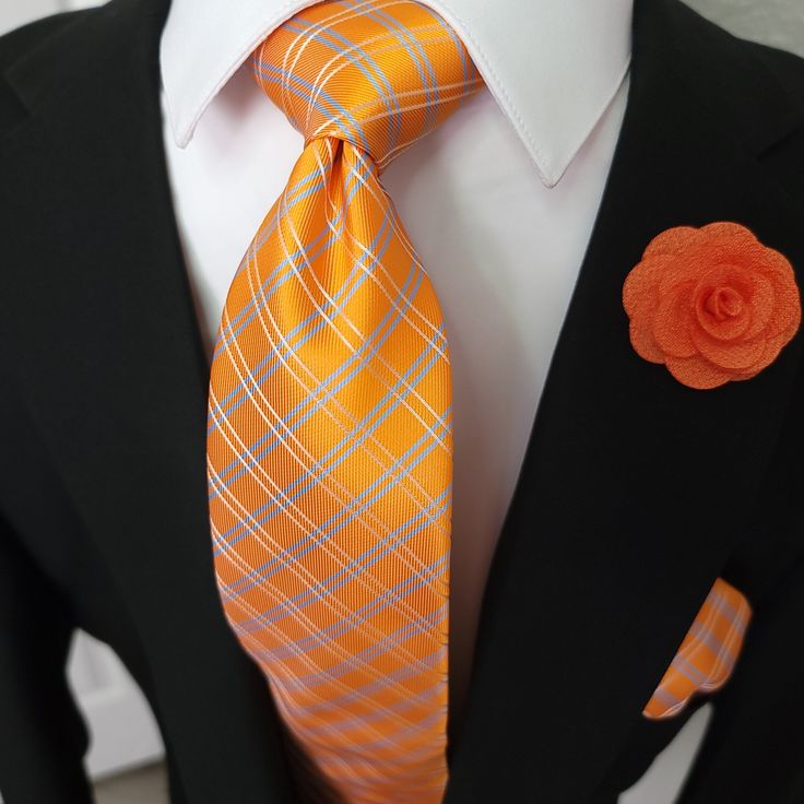 Treat yourself with a new pattern and splash of color to your look with this unique tie set. 100% Silk Handmade Package Includes: Tie, Pocket Square, Cufflinks & Flower lapel. Length: 59" Width: 3.34" Warm iron if needed We offer FREE International Shipping World Wide! Orange Formal Suit And Tie Accessories, Orange Standard Tie For Business, Orange Standard Business Tie, Elegant Orange Suit And Tie Accessories For Formal Occasions, Jw Family, Flower Lapel, Unique Ties, Orange Plaid, Cufflink Set