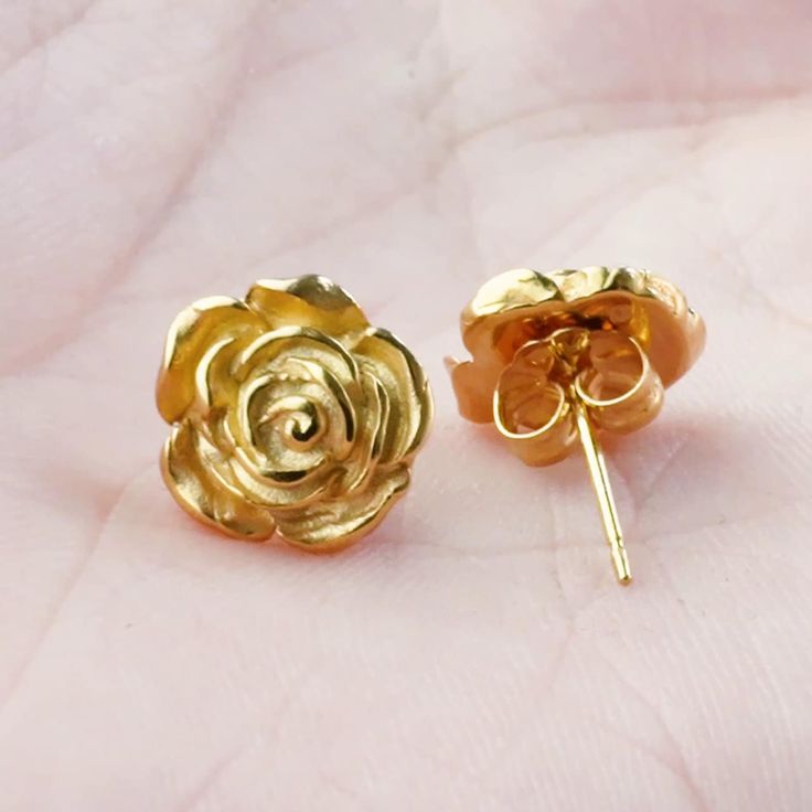 Hello, we handcraft all of our jewelry ourselves and we will ship fast. We design long lasting pieces for your everyday apparel. With beautifully sculpted petals, Kathe Mera Concept honors the roses, a symbol of self-love. They come gift wrapped ready to gift to yourself or your loved one. * Material:  Vermeil Gold (24k Gold over Solid Sterling Silver) * Size of Rose: Approx. 0.4 in diameter * Earring Type: Stud Earrings with butterfly back * Ready to Ship in 2 business days * Handmade in the US Gold Earrings With Roses, Gold Birth Flower Earrings For Gift, Gold Birth Flower Earrings For Anniversary, Gold Earrings With Birth Flower For Anniversary, Rose Design Flower Earrings For Anniversary, Gold Rose Design Earrings For Anniversary, Gold Tarnish-resistant Flower Earrings Perfect For Gifts, Gold Tarnish-resistant Flower Earrings For Gift, Gift Gold Flower Earrings Tarnish Resistant