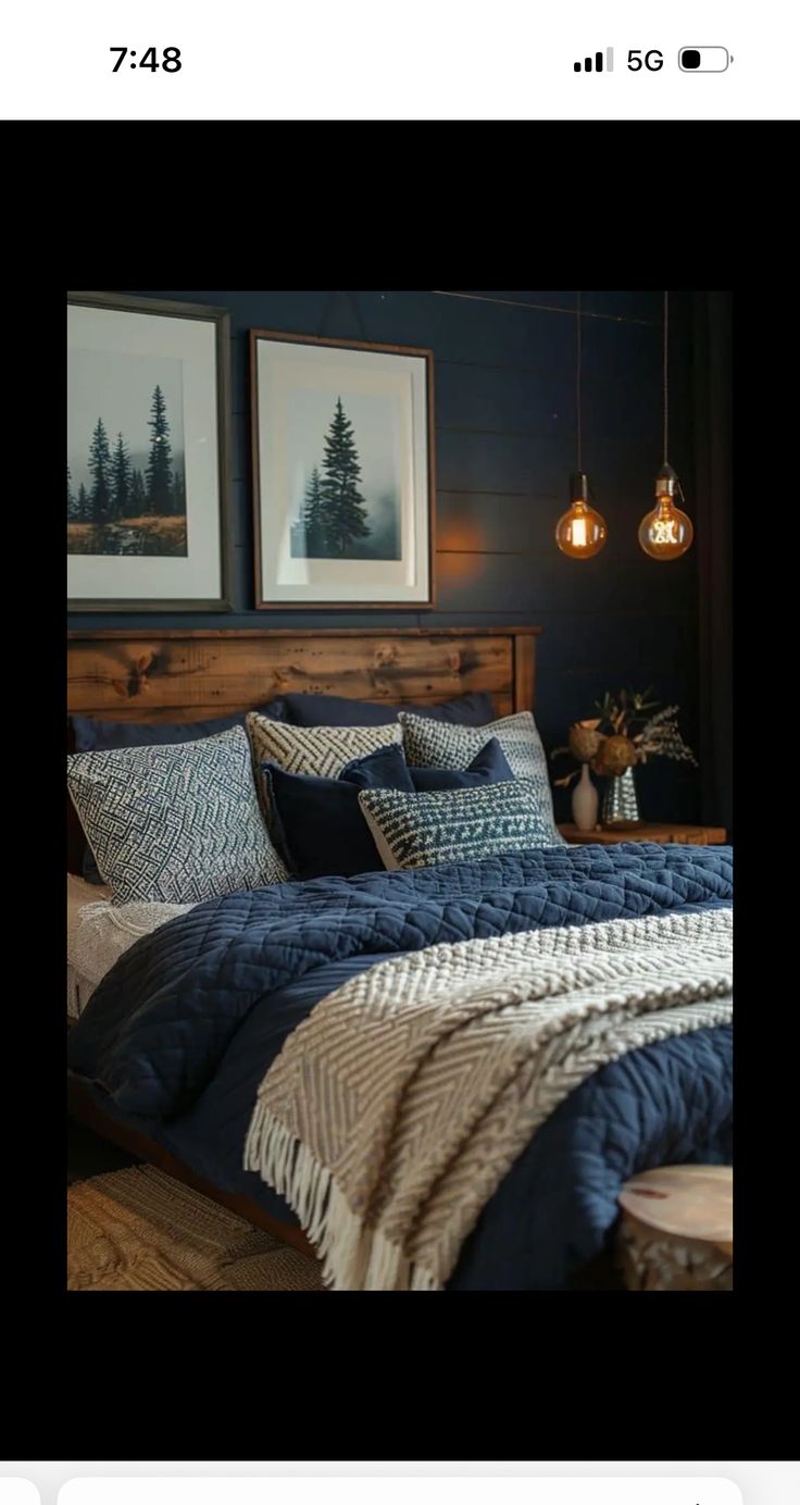 an image of a bed with blue sheets and blankets on it in a bedroom setting