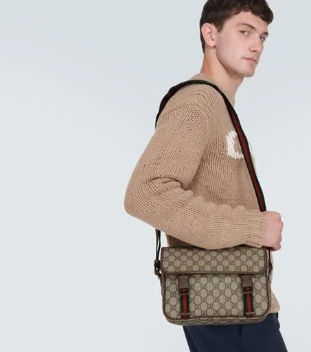 The GG Supreme canvas, a recurrent Gucci hallmark, takes centre stage in every collection. This messenger bag redefines travel essentials with a blend of beige and ebony canvas, infusing a contemporary touch, complemented by its adjustable shoulder strap..Material: fabric.Lining: fabric.Made in Italy.Trim: leather.Adjustable shoulder strap.Closure: push-lock fastening.Includes: dust bag.Height 20cm-8'.Width 26,5cm-10.5'.Depth 10cm-4'.Adjustable shoulder strap.Max. strap length 135cm-53'.Strap wi Gucci Brown Coated Canvas Shoulder Bag, Brown Gucci Coated Canvas Shoulder Bag, Gucci Canvas Bag With Adjustable Strap, Gucci Beige Crossbody Satchel, Gucci Travel Satchel Bag, Gucci Coated Canvas Satchel Shoulder Bag, Gucci Canvas Shoulder Bag With Leather Trim, Gucci Travel Satchel With Removable Pouch, Gucci Satchel With Removable Pouch For Travel