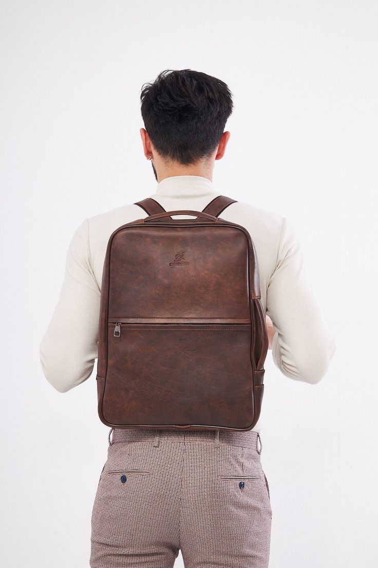 - Our product is 100% genuine leather. - It is produced in master hands with quality materials and delicate handwork. - Dimensions 43 x 33 cm Classic Leather Laptop Bag With Smooth Grain, Luxury Textured Leather Backpack For Daily Use, Luxury Leather Backpack With Textured Finish, Classic Soft Leather Backpack For Office, Classic Brown Laptop Backpack, Classic Leather Satchel Backpack With Smooth Grain, Luxury Leather Everyday Laptop Bag, Classic Textured Leather Backpack Bag, Classic Brown Rectangular Backpack