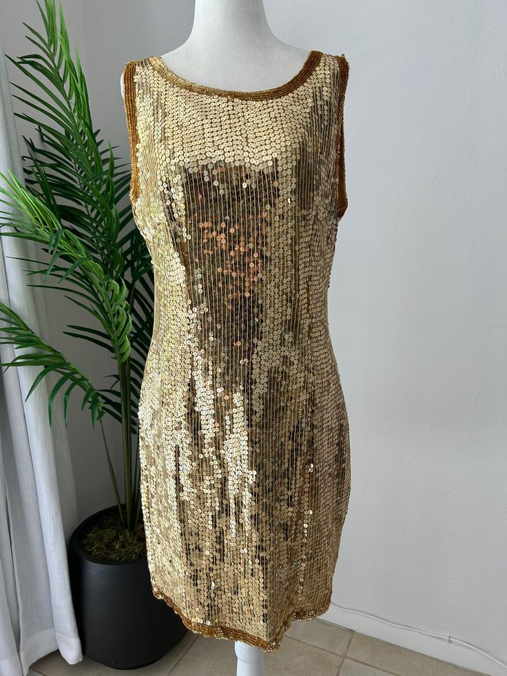 Stunning, gold sequin, mini, sleeveless, shift dress, perfect for New Years Eve. In overall great vintage condition, with only notable issue being a tiny patch of missing sequins on the back near the right arm pit, easily replaceable and not very noticeable. Dress is fully lined and zips up the back with a hook and eye closure at the top. No designers tag or labels, would best fit a modern size 8-10.   Measurements Chest 40in/101.5cm Waist 32in/81.5cm Hips 40in/101.5cm Length 36in/91.5 (strap to Sequin Shift Dress, Sleeveless Shift Dress, Sequin Mini, Cool Jackets, Gold Sequin, Nouvel An, Little Miss, Crop Jacket, Dress Clothes For Women