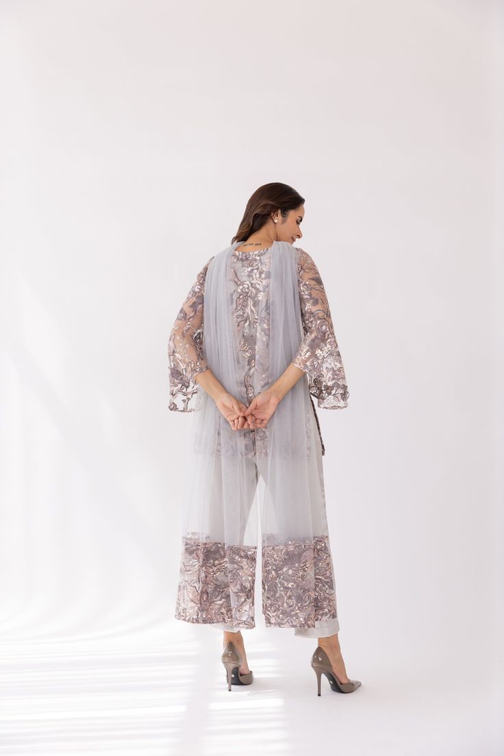 Featuring a silver embroidered boat neck kurta set in net base. It is paired with solid pants and net dupatta with sequin work. Color: SILVER FABRIC: NET Delivery time 15 to 20 days Evening Palazzo Set With Sheer Dupatta For Eid, Party Wear Palazzo Set For Evening Eid, Evening Palazzo Set With Resham Embroidery For Diwali, Evening Party Wear Palazzo Set For Eid, Eid Evening Party Wear Palazzo Set, Palazzo Set With Dupatta For Evening Eid, Evening Palazzo Set With Dupatta For Eid, Evening Palazzo Set With Dupatta For Diwali, Eid Evening Palazzo Set With Dupatta