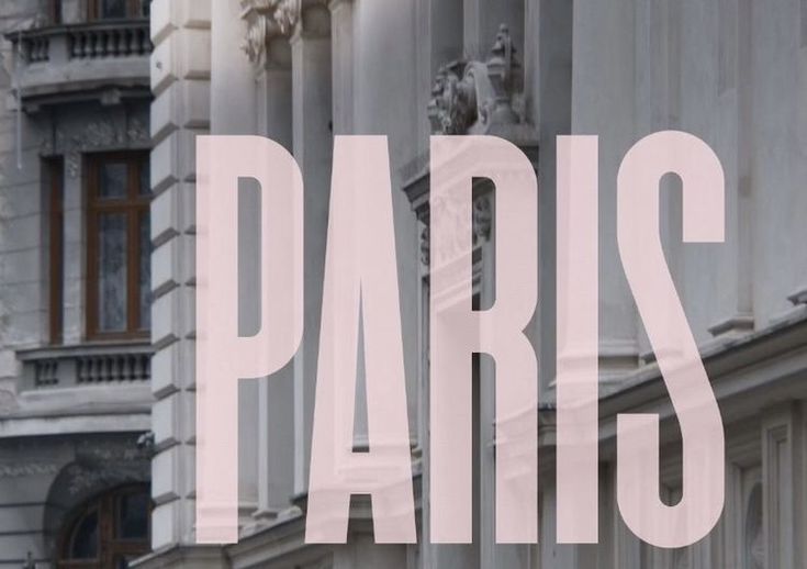 the word paris is displayed in front of an old building