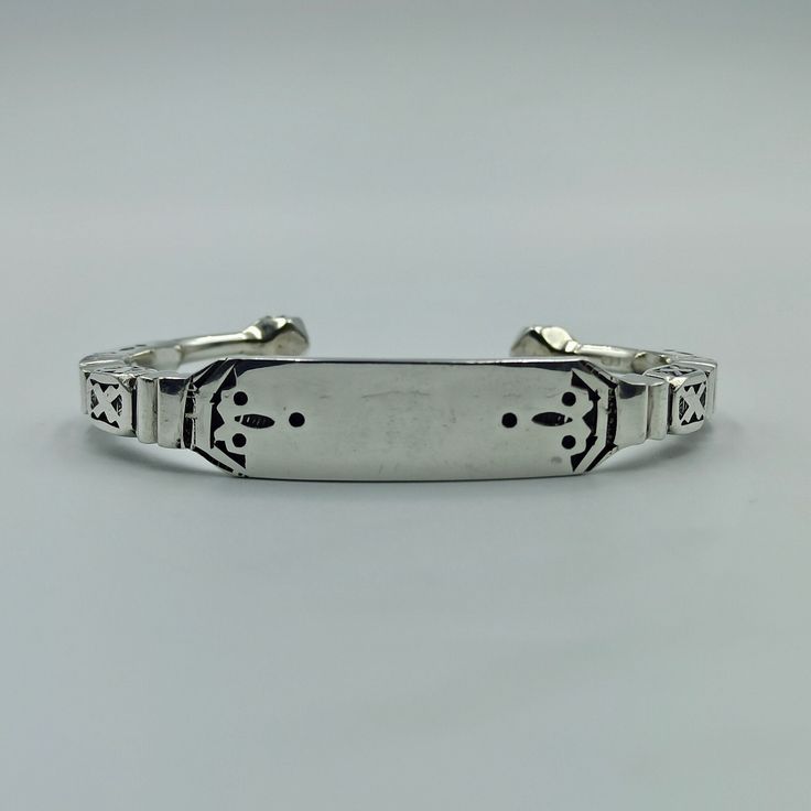 Unique jewelry, I can engrave your name on the bracelet Entirely made in 925 Silver, this Tuareg-inspired bangle will be your best ally to assert your style. The engravings with their black backgrounds bring depth and secrecy to this jewel. - Heavy Bracelet 46.4 gramme - Adjustable - Ideal for a multisize wrist  Contact me to have your name engraved on the unique tuareg bracelet Visit my shop: https://www.etsy.com/fr/shop/NoureddineJewelry Moroccan Bracelet, Tuareg Jewelry, Jewelry Mens, Silver Bangles, Your Name, Black Backgrounds, Favorite Jewelry, Mens Gifts, Bangle Bracelets