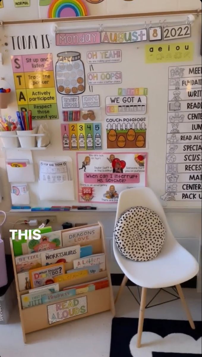 a white chair sitting in front of a bulletin board