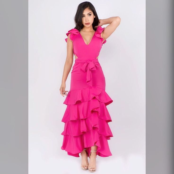 Perfect Look For Your Upcoming Events. -V-Neck -Ruffle Sleeves -Cut Sides -Waist Tie Up Party V-neck Maxi Dress With Ruffled Skirt, Party Maxi Dress With V-neck And Ruffled Skirt, Pink V-neck Dress With Ruffled Skirt, Party Maxi Dress With Ruffled Skirt And V-neck, Pink V-neck Maxi Dress With Ruffles, Feminine V-neck Maxi Dress With Ruffled Skirt, V-neck Maxi Dress With Ruffled Skirt, Layer Maxi Dress, Boutique Maxi Dresses