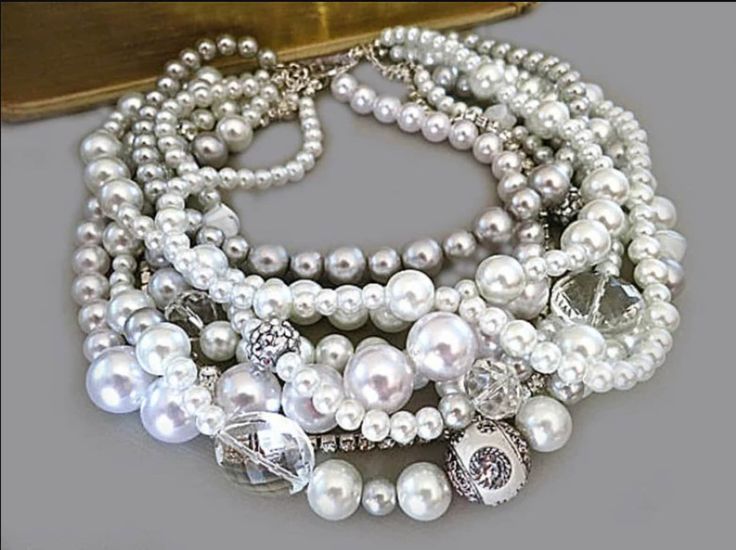 Introducing "Audrey's Elegance," a Chunky White & Grey Pearl Bridal Necklace by Audrey's Elegance. Step into a world of timeless grace with our "Audrey's Elegance" necklace, inspired by the classic sophistication of Audrey Hepburn's wedding style. This opulent piece features lustrous white and soft grey pearls meticulously strung together, creating a centerpiece for your bridal ensemble. Crafted with a bold spirit, this statement necklace offers a modern twist on traditional bridal pearls. Its c Chunky Jewelry Necklace, Statement Wedding Jewelry, Chunky Pearl Necklace, Layered Pearl Necklace, Stacked Wedding Rings, Chunky Pearls, Bridal Pearl Necklace, Baroque Pearl Necklace, Chunky Jewelry